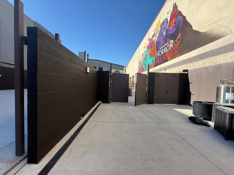 Commercial building exterior with painted block walls and mural