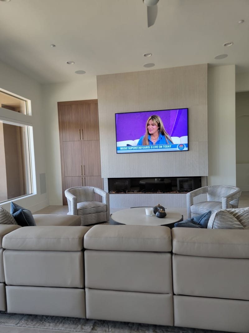 Modern living room with neutral painted walls and fireplace surround