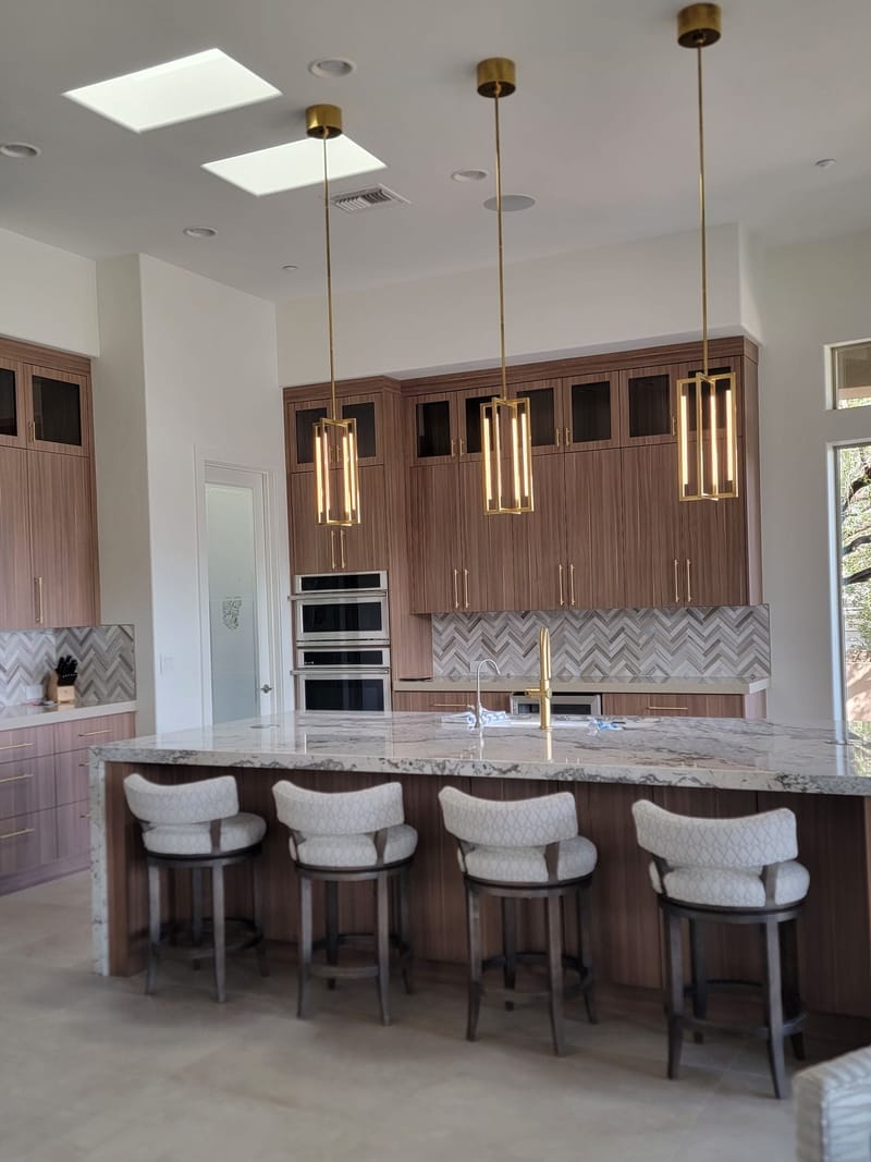 Luxury kitchen with painted walls and wood-tone cabinetry