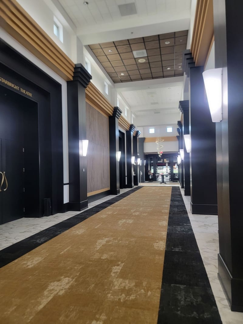Commercial hallway with painted black and gold Art Deco columns