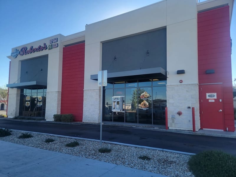 Roberto's restaurant exterior with red and gray painted facade