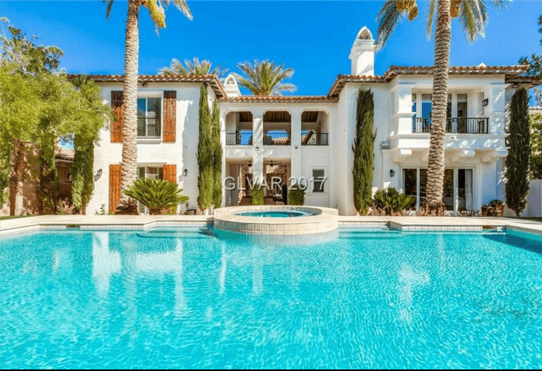 Luxury home with pool and freshly painted white exterior